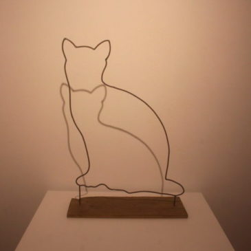 “gatto seduto”
